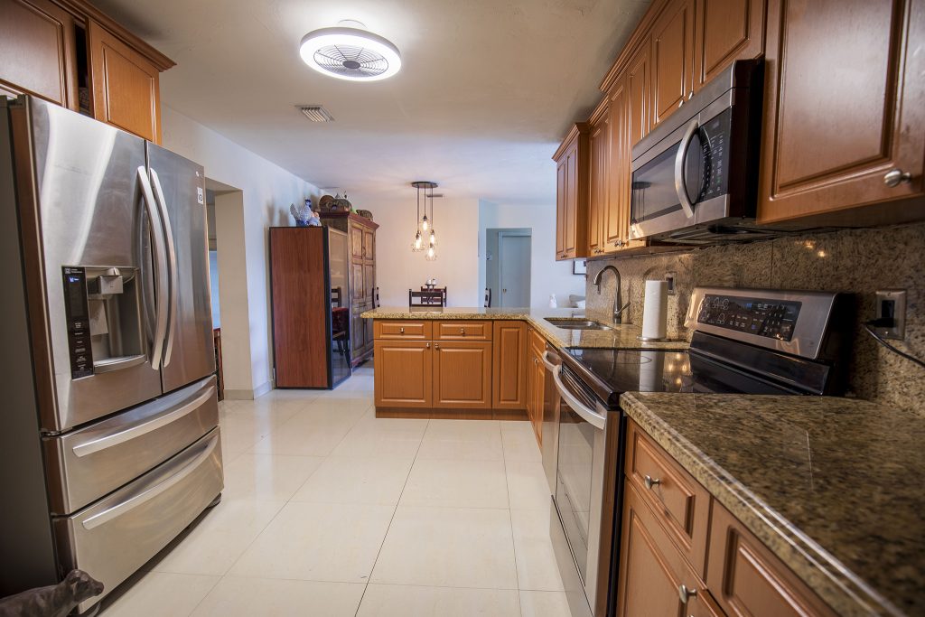 Home Modern kitchen with stainless steel appliances and granite countertops