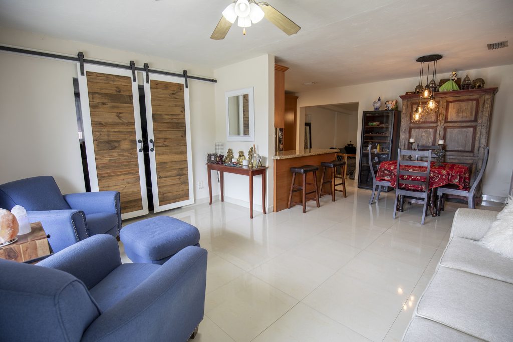 Open-concept living and dining area at 6445 Funston St